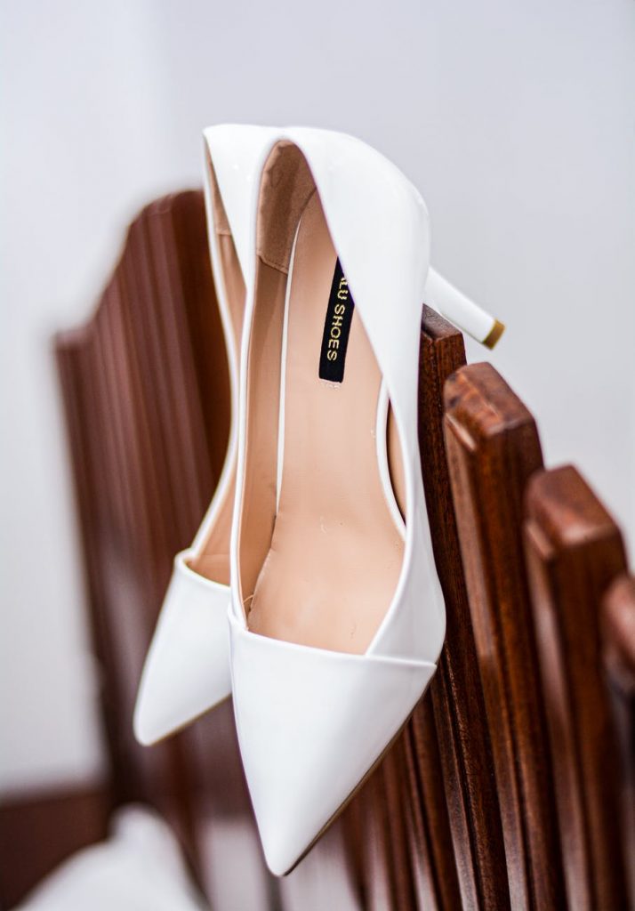 pair of white heeled shoes