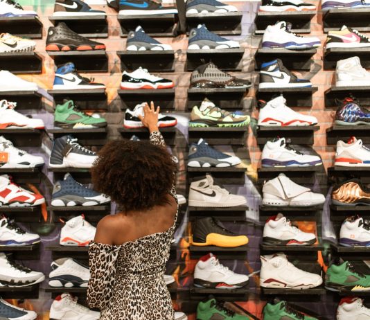 a woman shopping for a rubber shoes