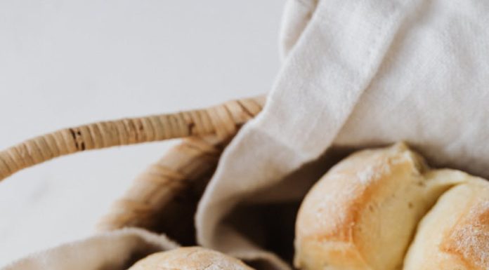 freshly baked white bread buns in a basket
