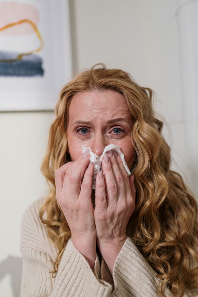 woman suffering from her allergy