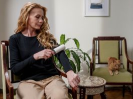 woman using lint remover