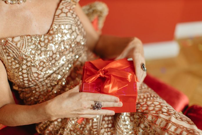 a person holding a present