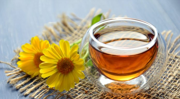 clear glass bowl beside yellow flower