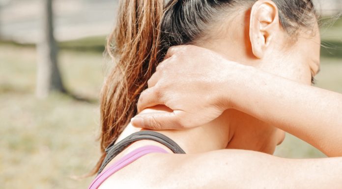 close up photo of woman having a neck pain
